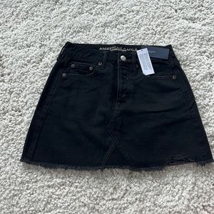 Black denim mini skirt